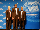 Abdulrahman Hassaballah (middle) accepting his award for Excellence in Research, Scholarship & Creativitiy, flanked by UB Provost Charles F. Zukowski (left) and President Satish K. Tripathi (right)