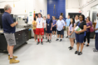 Students touring the UB machine shop. 