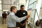 Biplab Bhattacharya talks with Professor Edward Furlani about his poster.