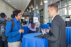 A graduate student talks to Jim Chou, Chief Technical Officer at Workmarket (right). Chou later delivered a keynote speech on the rapidly changing pace of technology and the critical importance that soft skills and adaptability play in today’s job market.