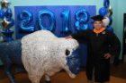 student at graduate commencement reception with UB Bull. 