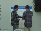 Two students looking at a research poster. 