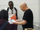 Students receiving resume advice from Zwolinski (right).