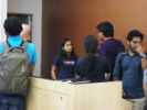 Chaudhari (center) answering student questions after the conclusion of the Resume Workshop.
