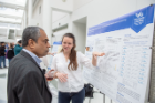 Associate Dean for Graduate Education and Research Shambhu Upadhyaya talks with a student during the CDSE Days Poster Session. Photo credit: The Onion Studio.