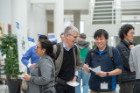 Robert Moser, University of Texas at Austin, and James Chen, UB Department of Mechanical and Aerospace Engineering, share some laughs during the CDSE Days Poster Session.