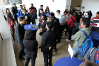 Shrivardhan Joshi (left), environment, health and safety manager at Tesla, Inc. and UB industrial engineering alumnus, talks to students during the Career Preparation Reception.