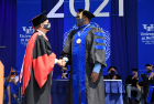 President Satish Tripathi presents the University at Buffalo President’s Medal to Dexter Johnson, PhD ’95 Mechanical Engineering, Technical Fellow for Loads and Dynamics at NASA.