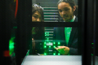 Jocelin Mendez (left) and Shane Varner (right), both chemical engineering students, examine the server used for their research at UB’s Center for Computational Research.
