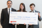 Showing off their check for the first-place win were, from left, Thiru Vikram, Emilie Reynolds and Alexander Zhitelzeyf. Photo: Nancy J. Parisi