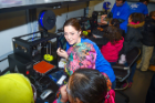 UB student volunteers help West Hertel Academy students print 3-D models of wind turbines in the Buffalo Manufacturing Works Additive Manufacturing Learning Lab. Photo: Nancy J. Parisi