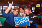 From left: Nancy L. Wells, vice president for philanthropy and alumni engagement; Nancy E. Paton, vice president for university communications; and Laura E. Hubbard, vice president for finance and administration, back the Bulls. Photo: Douglas Levere