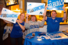 Showing their UB pride are, from left, Jackie Hausler, director of communications and alumni relations for the School of Public Health and Health Professions, and Alumni Engagement staff members Janice Vecchio and Dan Brewster. Photo: Douglas Levere