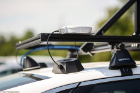 A close-up look at the GPS antenna — the light-colored box sitting on top of the roof rack — which connects to a cable box below.