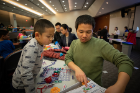 Han, age 5, and dad Xiang Zhang get down to business with some Snap Circuits.