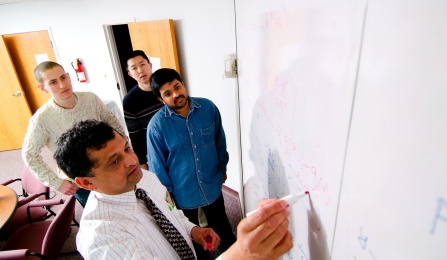 Zoom image: Sargur Srihari and students collaborate in a CEDAR research lab. Photographer: Douglas Levere 