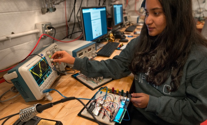 female student in electrical engineering tinkering lab. 