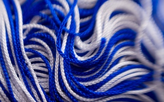 closeup image of blue and white graduation tassel. 
