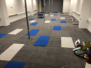August 22, 2019. GP Flooring has the carpeting mostly installed. They just need to cut in a few color pops and install the vinyl cove along the wall base.