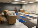 August 28, 2019. Prentice has begun delivering and installing the central collaboration furniture. The Electrical Shop has changed out all the electrical fixtures with white models. We've laid out two additional rows of carpet tiles.