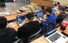 UB ACM students at a hack night event.