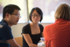 Shi Li and his wife exchange ideas with Liesl Folks.