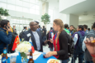 SEAS alumnus Akinlaja Caulcrick talks with graduate students at the Welcome and Networking Reception.