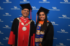 Graduate student speaker Susan Paul stands with UB President Satish Tripathi before the graduate commencement ceremony.
