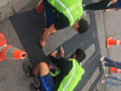 Two IISE members trace lines before painting a crosswalk at one of GObike's Tactical Pop-up Projects.