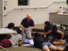 Bob Zwolinski (center) helping a group of students during the Google Games event.