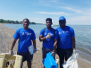 Paolo Bourdeau (L), (CSEE ‘20), David Campbell (M) (CSE, 21) and William Rocky Sandjo (R) (EE, 2020) picking up debris during the “Adopt-a-Beach” clean-up of Woodlawn Beach. 