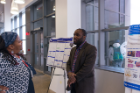 First place winner Ogechi Ogoke discusses his poster, "An in Vitro 3D Model of Liver Development Using Human Pluripotent Stem Cells," with SEAS Director for STEM Diversity Programs Letitia Thomas. 