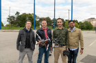 From left, Nick Mastronarde, Adam Czerniejewski, Farshad Ghanei and Karhik Dantu show off their drones. 