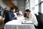 Kim Helmer (right) of Zodiac Aerospace reviews a resume during the walk-up session, along with Holly Justice of UB’s Career Services office and Melissa Lauricella of Astronics.