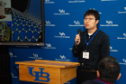 Yixiong Zheng speaking at poster session. 