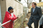 Edwards talks with Flint resident Lewis Spears, who participated in his water study.