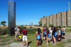  Students gather at Elevator B, a honeycomb-themed tower designed to house bees at Silo City.