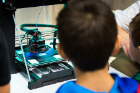 A 3-D printer produces parts for a project.