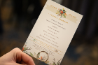 A decorative table card describes the evening's events.