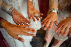 Members of the bride's party show off their henna tattoos.
