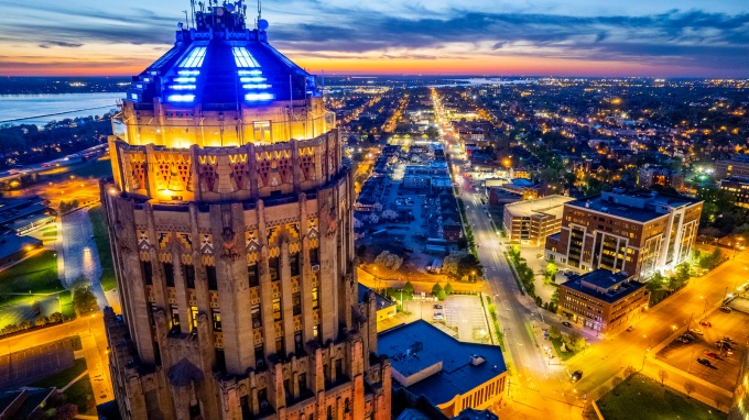 City Hall and Downtown Buffalo lit up at night. 