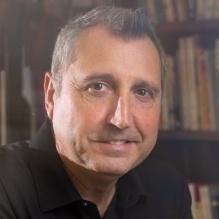 A portrait of David Castillo, with the department of romance languages and literatures, taken in August 2023 in Clemens Hall. \n\nPhotographer: Douglas Levere. 