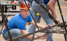 Students with the American Society of Civil Engineers (ASCE) practice building their steel bridge in the Stevens Courtyard between Davis and Jarvis Halls in May 2019. Photographer: Meredith Forrest Kulwicki. 