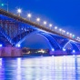 Peace Bridge lit up blue at night. 