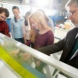 Photo of Prof. Jim Jensen and students working on sluice gate in hydraulics lab. 