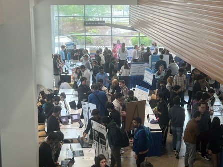 Zoom image: Students gather for Demo Day in Davis Hall.
