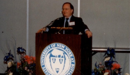 Zoom image: CS Department Chair Alan Selman greets guests from the podium at the UB Center for Tomorrow 