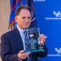 CSE Departmental Advisory Board Co-Chair Russ Agrusa receives a glass sculpture at the Paula T. Agrusa Plaza dedication ceremony, November 5, 2021. 