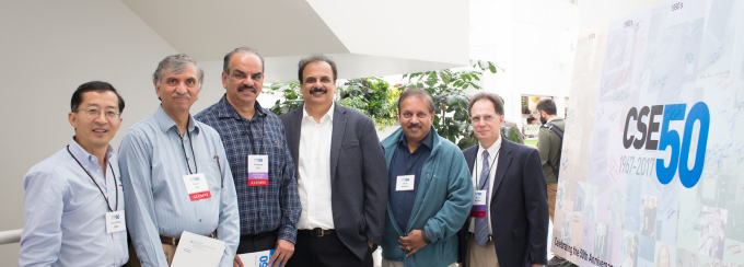 Chunming Qiao, Sunil Pai, Pradeep Bahl (MS'84), Victor Bahl (BS '86, MS '88), Ram Sridhar and Russ Agrusa (BS '76). stand together posing near a sign that says CSE50. 