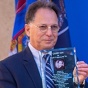 CSE Departmental Advisory Board Co-Chair Russ Agrusa receives a glass sculpture at the Paula T. Agrusa Plaza dedication ceremony, November 5, 2021. 